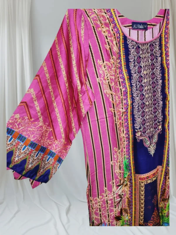 A black and white robe hanging on a clothes hanger, featuring a detailed pattern, displayed indoors.